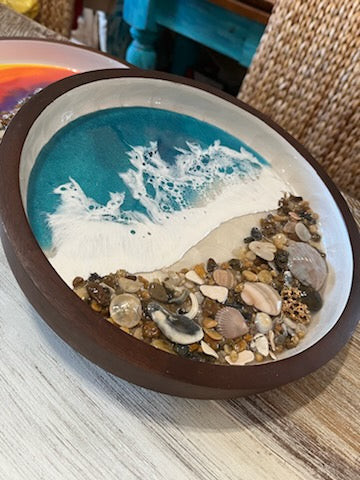 Beautifully decorated resin ocean waves inside this 10" round wooden serving tray, Dark wood with white swirls inside. Top half is pretty Teal Resin Ocean Waves crashing on real Outer Banks North Carolina sea shells. Collected from beaches on the OBX. 