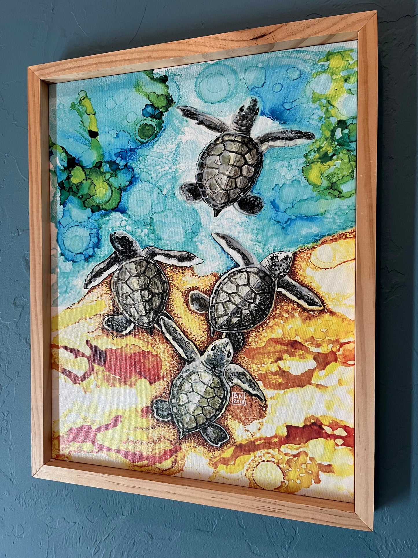 Baby Sea Turtles Entering the Ocean Can16" x 22" Baby Turtles Canvas Wood Framed Print of original alcohol ink painting by Barbara Newsome.  If you are a sea turtle fan, you will love this canvas print depicting 4 baby sea turtle hatch-lings making their way to the ocean and future. The painting was created using alcohol inks and pens. The print is framed with natural pine wood.vas. Barbara Newsome OBX Artist