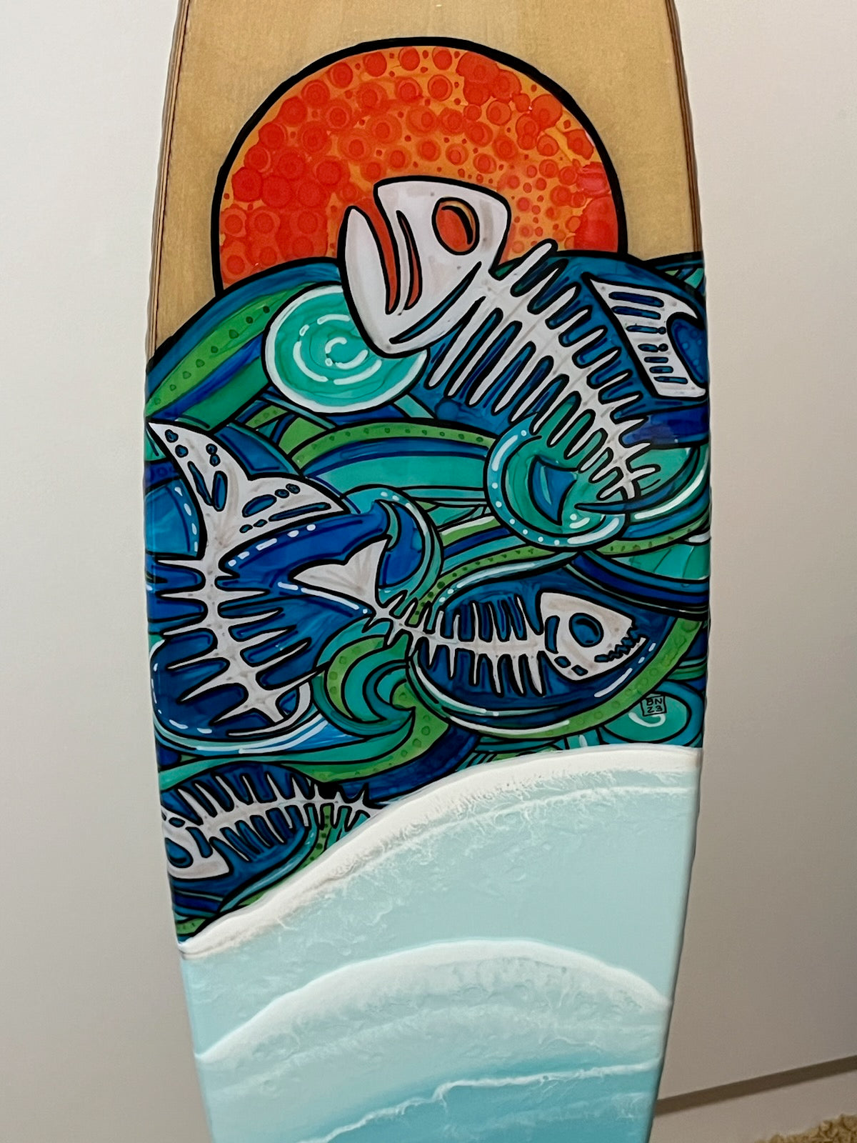 Surfboard Art. Wooden Surfboard Shape, Ocean Resin Waves with Fish Bones Dancing in the Ocean